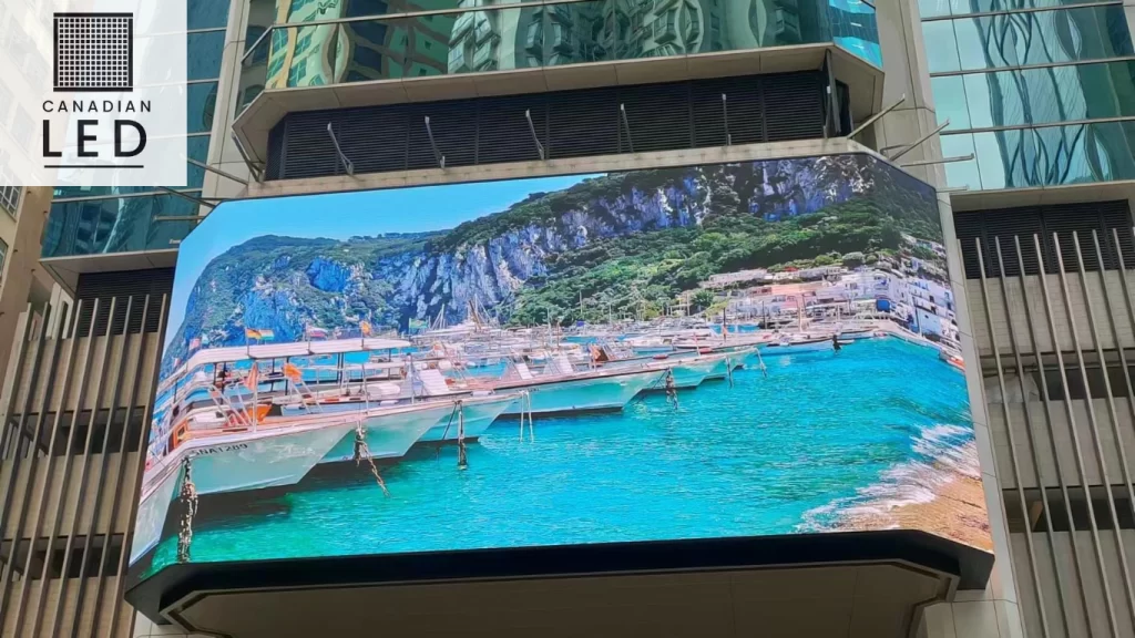 A high-resolution outdoor LED screen displaying a stunning image of a cave with a yacht, showcasing vibrant colors and sharp details.