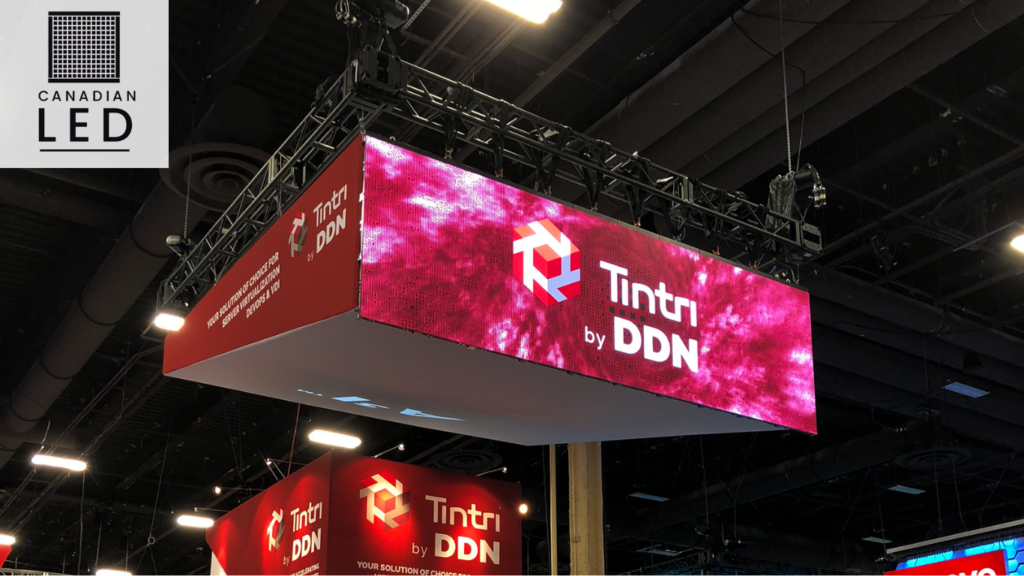 Hanging LED video wall display showcasing Tintri by DDN branding at a trade show booth.