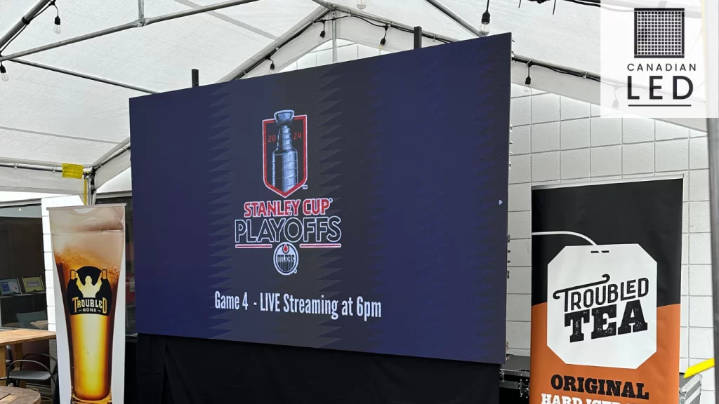 Outdoor LED screen displaying Stanley Cup Playoffs live at a beer garden, presented by Canadian LED.